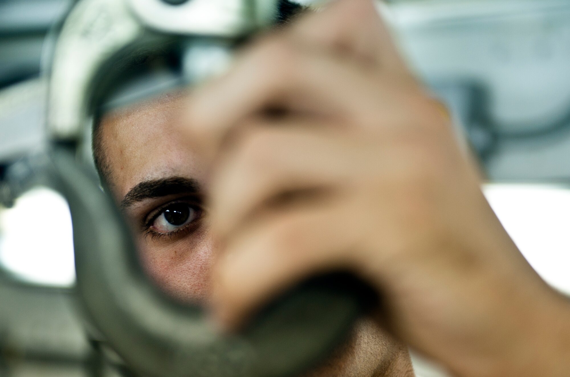 Airman 1st Class Giovanni Costanza, 39th Maintenance Squadron technician, closely scrutinizes a hook during his day-to-day operations Aug. 2, 2013, at Incirlik Air Base, Turkey. Costanza is a native of Hammond, La. and a first-term Airman at Incirlik AB. (U.S. Air Force photo by Senior Airman Daniel Phelps/Released)