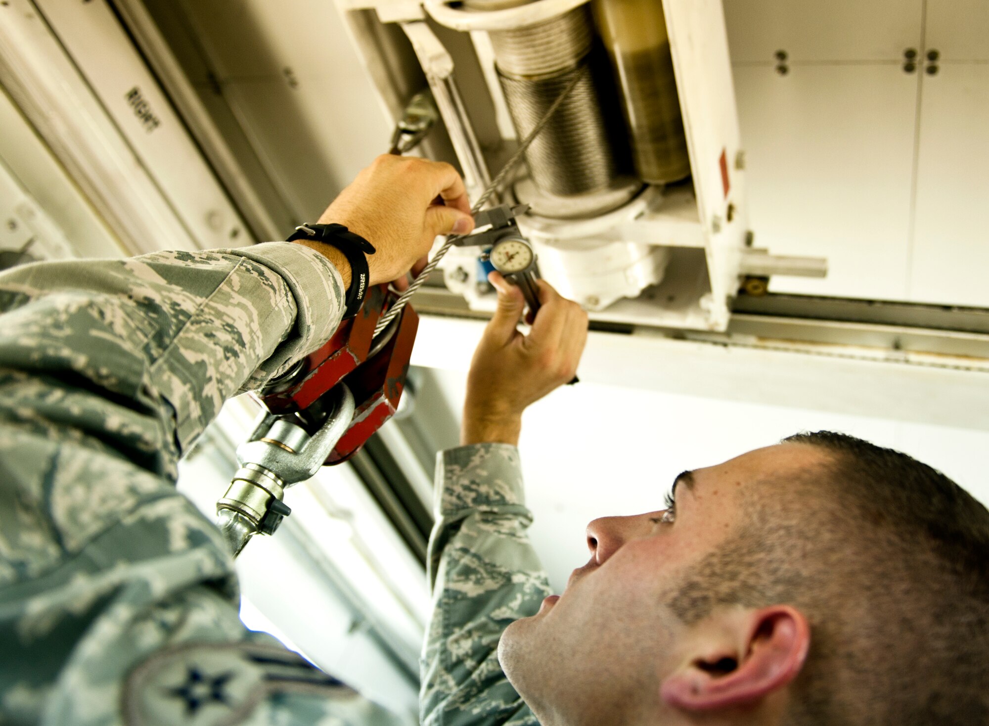 Airman 1st Class Giovanni Costanza, 39th Maintenance Squadron technician, inspects a piece of equipment to ensure there are no flaws Aug. 2, 2013, at Incirlik Air Base, Turkey. Costanza’s job as a technician requires exquisite attention to minute details. (U.S. Air Force photo by Senior Airman Daniel Phelps/Released)