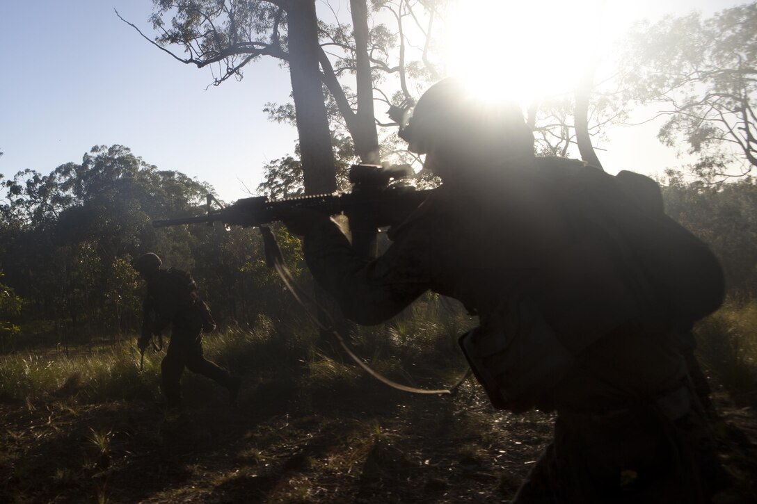 Marines with Company G., Battalion Landing Team 2nd Battalion, 4th Marines, 31st Marine Expeditionary Unit, sprint toward a notional enemy machine gun bunker during a live-fire and maneuver event here, July 31. The marksmanship training followed the conclusion of exercise Talisman Saber 2013, a biennial training activity between the U.S. and Australian armed forces aimed at providing realistic and relevant training necessary to maintain security, peace and stability in the Asia-Pacific region. The 31st MEU is the Marine Corps’ force in readiness for the Asia-Pacific region and the only continuously forward-deployed MEU.
