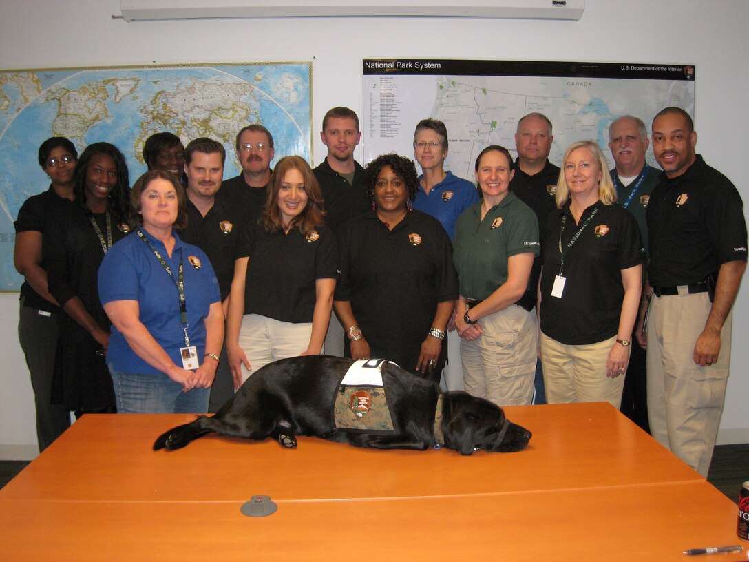 Marine veteran Sgt. Andrew Goodrich (middle) stands with his coworkers from the National Parks Service. Goodrich sustained a traumatic brain injury and structural, spinal and nerve damage during a training exercise at Cherry Point, N.C., in 2008.  After his injury, Goodrich wanted to continue his service to others, even though he would not be able to remain in the Marine Corps.
