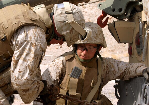 Lance Cpl. Mark Karwatka and Cpl. Joshua Velasquez, motor vehicle operators with Marine Wing Support Squadron 171 hook up a humvee to tow back to their compound in an vehicle recovery exercise near the Combat Center's Noble Pass training area Sept. 11, 2012.