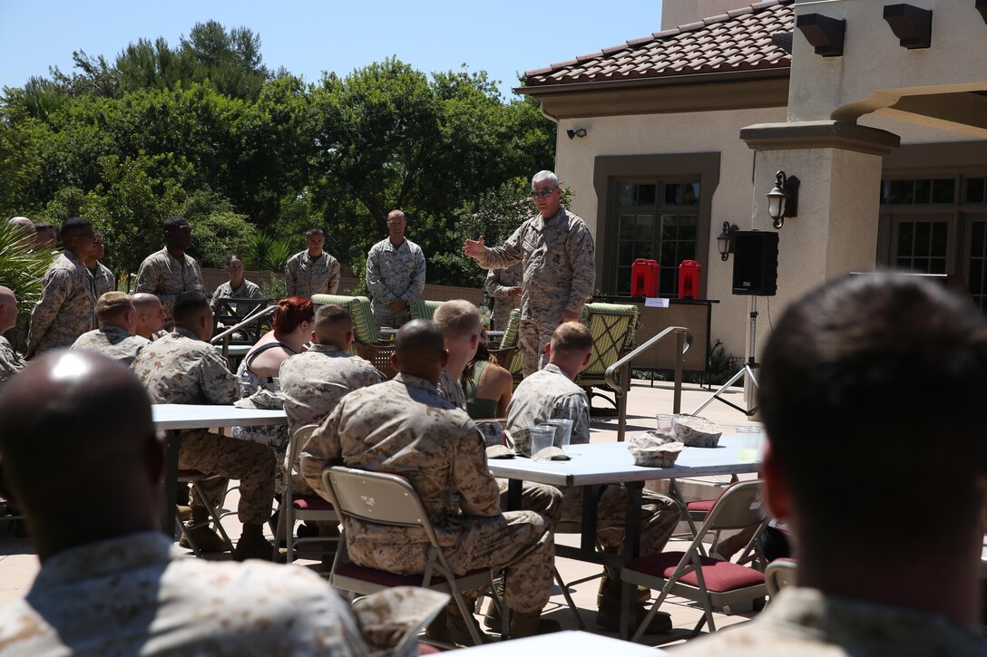 Lt. Gen. John A. Toolan, commanding general of I Marine Expeditionary Force, thanks Marines and spouses of Marine Wing Support Squadron 373 for their participation in the Veterans Village of San Diego Stand Down during a luncheon held in their honor aboard Marine Corps Air Station Miramar, Calif. Aug 12. The VVSD Stand Down spreads awareness about local homeless veterans and these Marine volunteers were pivotal in making the event a success.
