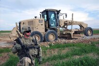 Sgt. Jon Burlingame, with Charlie Company, 1st Battalion, 38th Infantry Regiment provides security for Soldiers with the 229th Engineer Company, Wisconsin Army National Guard, and their Afghan counterparts during a road construction project in the Panjwa'i district in Kandahar Province, Afghanistan, March 28, 2013.