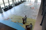 Alabama National Guard Soldiers brief hurricane plans on a 45x80 ft. map at Alabama National Guard headquarters, Montgomery, Ala., April 21, 2013, as part of a drill to prepare for the upcoming hurricane season.