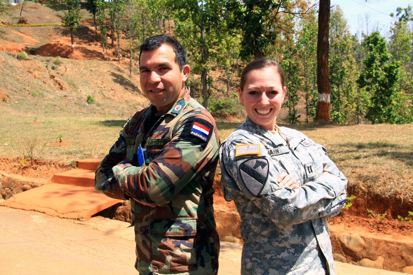 Capt. Andi Hahn stands with a captain from the Paraguay army during the peacekeeping exercise Shanti Prayas-2 in Kathmandu, Nepal, March 24, 2013.