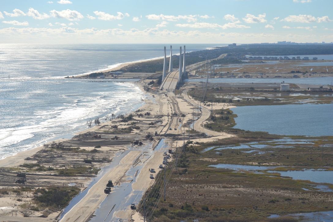 Hurricane Sandy caused overwash and flooding at the north shore of the Indian River Inlet. Route 1 was closed for several days. The U.S. Army Corps of Engineers Philadelphia District helps restore the north shore by pumping more than half a million cubic yards of sand from the inlet onto the beach and constructing a dune. 