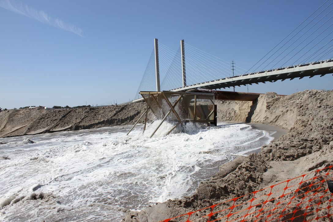 The U.S. Army Corps of Engineers Philadelphia District helps restore the north shore of the Indian River Inlet by pumping more than half a million cubic yards of sand from the inlet onto the beach and constructing a dune. Hurricane Sandy caused overwash and flooding on the north shore, forcing Route 1 and the Indian River Inlet Bridge to close for several days. 