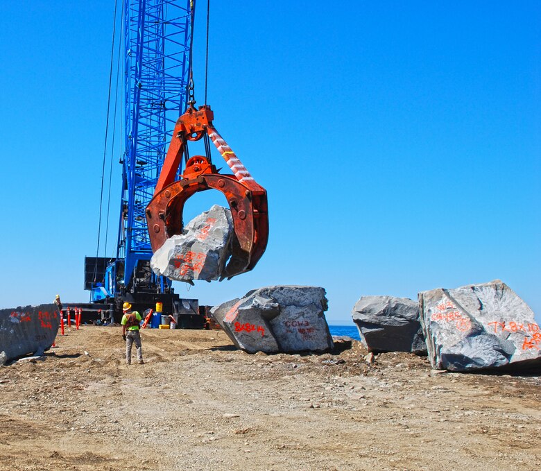 On the Oregon coast, mobile cranes moved enormous rocks to repair the cap of the Tillamook Jetty. These modern workhorses lugged rocks weighing up to 50 tons to build up a safer entrance to Tillamook Bay for maritime traffic.