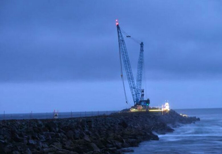 On the Oregon coast, mobile cranes moved enormous rocks to repair the cap of the Tillamook Jetty. These modern workhorses lugged rocks weighing up to 50 tons to build up a safer entrance to Tillamook Bay for maritime traffic.
