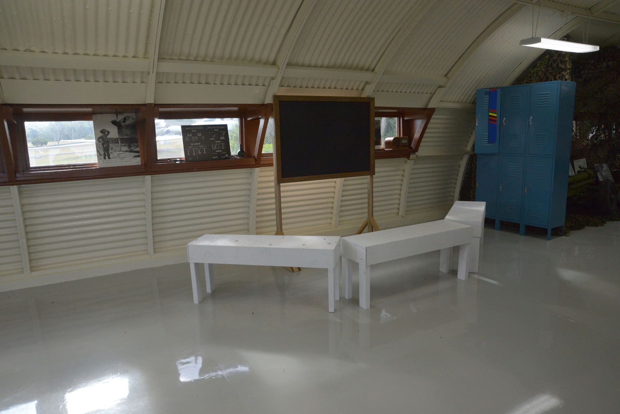 Decades ago, most on-base, indoor activities took place in Quonset huts.  This shows how a hut used for daily briefings would have looked in its hayday.  This is the last standing Quonset hut on Kadena Air Base, Japan.  It was recently renovated to show Airmen of today what life was like on their base years ago. (U.S. Air Force photo by Tech. Sgt. Jocelyn Rich-Pendracki/Released)