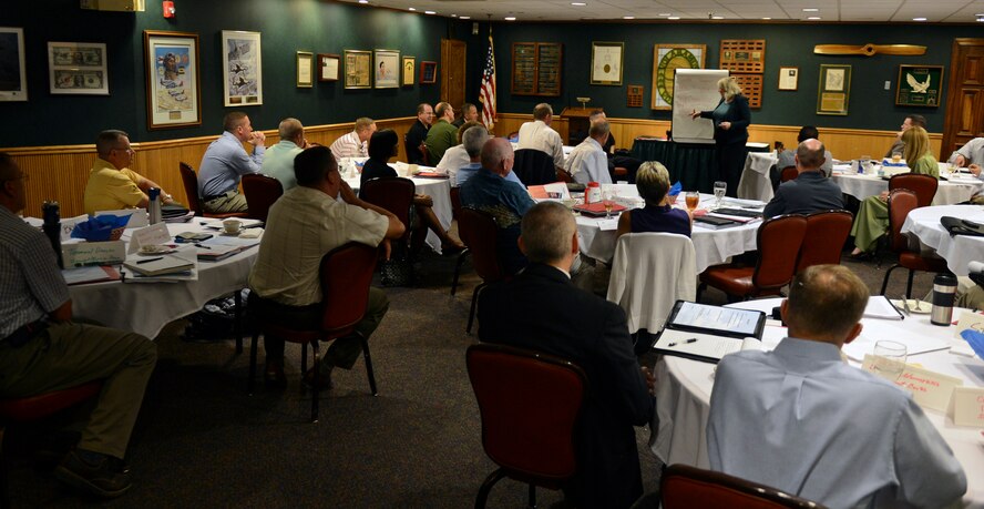 Sue Thompson, Airman and Family Readiness Center contractor, gives an executive Transition Assistance Program briefing at the Barksdale Club on Barksdale Air Force Base, La., Aug. 13, 2013. The executive TAP briefing informs high ranking military members on how to write resumes and search and apply for executive positions outside of the Air Force. (U.S. Air Force photo/Senior Airman Micaiah Anthony)