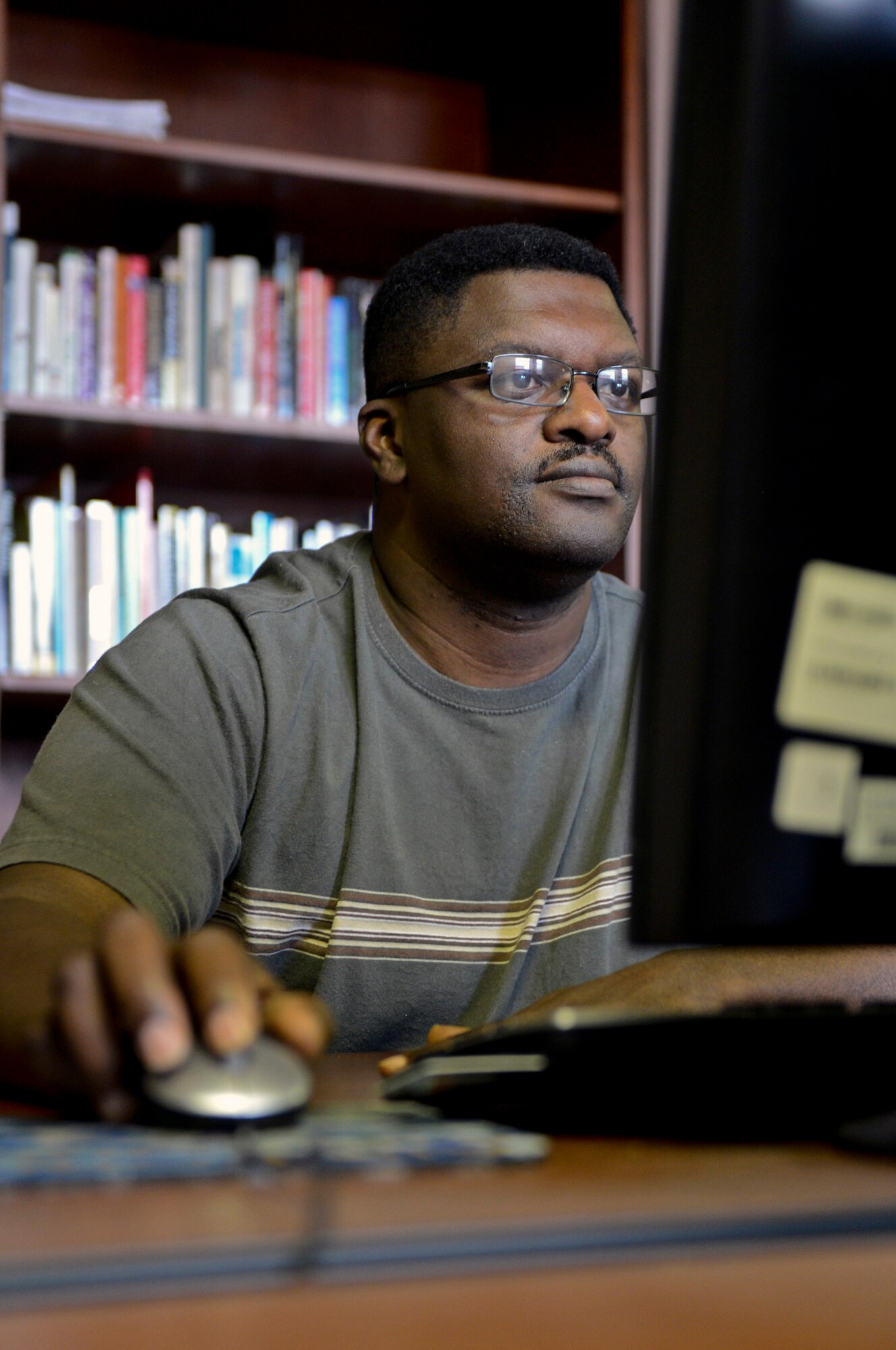 Senior Master Sgt. Clifton Washington, 2nd Aircraft Maintenance Squadron aircraft maintenance unit superintendent, works on a computer at the Airman and Family Readiness Center on Barksdale Air Force Base, La., Aug. 13, 2013. The A&FRC has a computer lab called the Discovery Resource Center where Airmen, retirees and dependents can search for jobs, edit resumes or use the internet. (U.S. Air Force photo/Senior Airman Micaiah Anthony) 