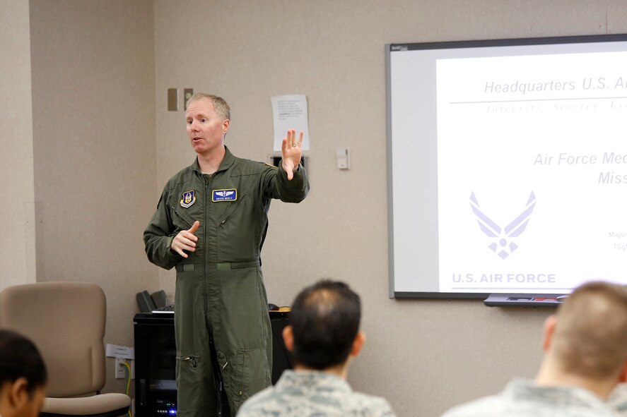 Col. (Dr.) Bruce Neely, the 446th Aerospace Medicine Squadron chief of Aerospace Medicine gives feedback to 446th AMDS Reserve Airmen at a mass casualty tabletop exercise hotwash during the Reserve UTA weekend, Aug. 10. The exercise is a precursor to the hand's on exercise the squadron will participate in 2014 in order to maintain its readiness. (U.S. Air Force Reserve photo/Master Sgt. Jake Chappelle)