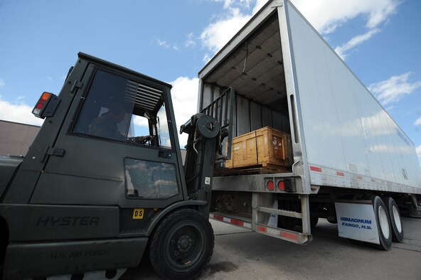 Senior Airman Timothy Hunter, 28th Logistics Readiness Squadron traffic management technician, operates a forklift to remove a shipment at the Packing and Crating Receiving Center on Ellsworth Air Force Base, S.D. Aug. 8, 2013. Shipments of mission capable parts must be processed and delivered to the appropriate maintenance shop within a strict time frame to ensure that maintenance Airmen have what they need to sustain mission readiness at all times. (U.S. Air Force photo by Airman 1st Class Rebecca Imwalle/Released)