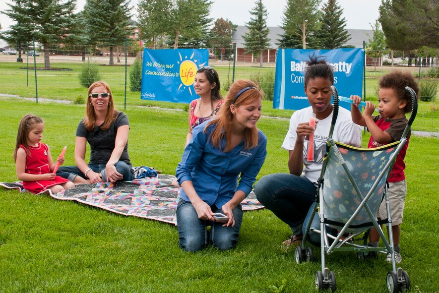 130809-F-BR137-006
F.E. Warren families and Balfour Beatty Communities staff gather near the playground between Quarters 2 and 7 Aug. 9, 2013, for one of BBC’s “Fun in the Sun” days, a family-focused “Lifeworks” gathering for BBC residents. BBC’s next Lifeworks event is a back-to-school clothing swap scheduled for Aug. 20 in the Fall Hall Community Center. To participate in the swap, people must RSVP by Aug. 19 by calling 514-5000. (U.S. Air Force photo by Airman 1st Class Jason Wiese)
