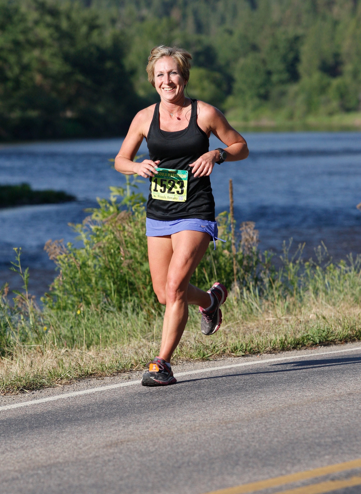 Tech. Sgt. Tracy Trosine, 92nd Logistics Readiness Squadron equipment accountability element NCO in charge, runs the Missoula Marathon in Missoula, Mont., July 14, 2013. Trosine has been running marathons since 2008 and recently got picked to be an ambassador for the Wounded Warrior Program. (Courtesy Photo)
