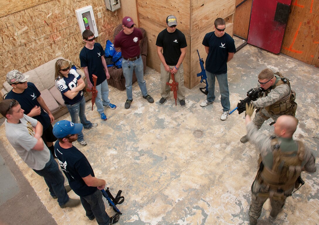 130810-F-CP692-068
Tech. Sgt. Jeremy Hall, 90th Security Forces Group Tactical Response Force team leader and Senior Airman Cody Clawson, 90th SFG TRF explosive breacher, instruct the proper shooting stance for close quarters battle operations during an Air Force recruiting "Battlefield Airmen" event Aug. 10 in the TRF shoot-house on F.E. Warren Air Force Base. There were approximately 40 Delayed Entry Program recruits and potential applicants who took part in a two-day Air Force familiarization program. This was the first time eight recruiting locations from Wyoming, Nebraska and Colorado came together to showcase what the Air Force has to offer.  (U.S. Air Force photo by 1st Lt. Eydie Sakura)
