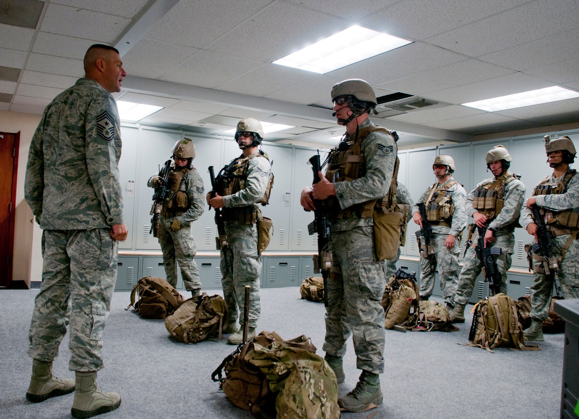 130808-F-BR137-116
Chief Master Sgt. David Nordel, 20th Air Force command chief, speaks to 90th Security Forces Group Tactical Response Force members after they demonstrated their mission preparation process Aug. 8, 2013. Nordel toured 90th SFG facilities to familiarize himself with the group’s safety and training procedures. (U.S. Air Force photo by Airman 1st Class Jason Wiese)
