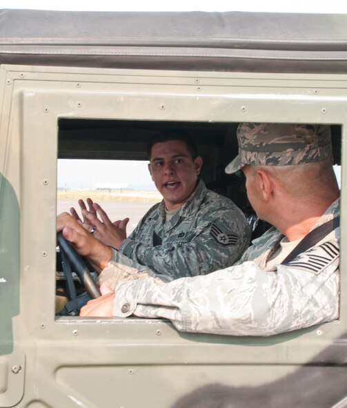 130808-F-BR137-011
Staff Sgt. Scott Bloom, 90th Security Support Squadron trainer, briefs Chief Master Sgt. David Nordel, 20th Air Force command chief, about Humvee driving safety procedures on the winter driving training pad Aug. 8, 2013. Each year, 90th Security Forces Group personnel drive millions of miles combined, so Nordel toured 90th SFG facilities to find ways to standardize safety training across 20th Air Force. (U.S. Air Force photo by Airman 1st Class Jason Wiese)
