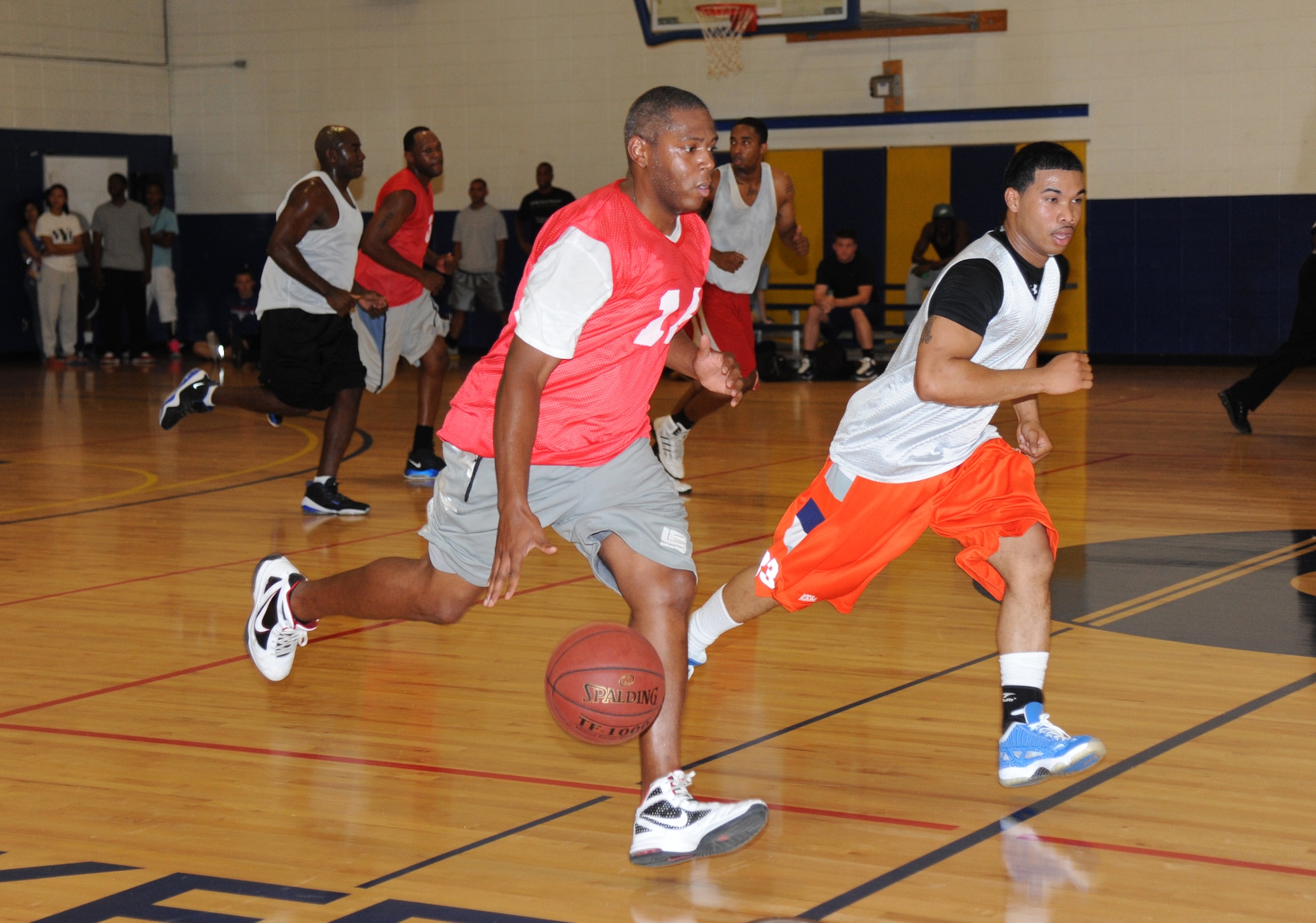 Vernon Peoples, 81st Communications Squadron, drives the ball down the court during an intramural basketball game Aug. 12, 2013, at the Blake Fitness Center, Keesler Air Force Base, Miss.  The 81st MDG defeated the 81st CS, 59-48.  (U.S. Air Force photo by Kemberly Groue)