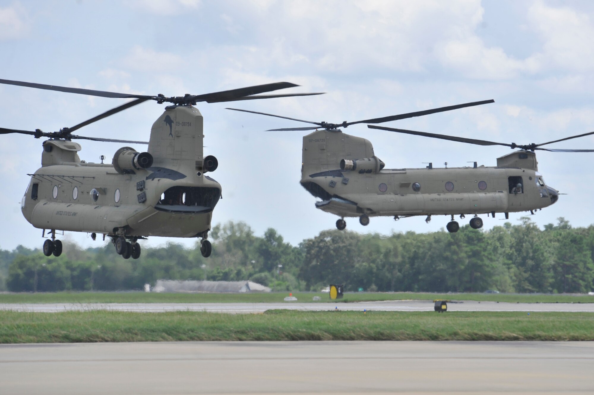 Two of three Army Boeing CH-47F Chinooks lift off from Shaw Air Force Base, S.C., Aug. 9, 2013. The Chinooks are stationed at Fort Bragg, N.C., and are with the 82nd Combat Aviation Brigade. (U.S. Air Force photo by Airman 1st Class Jonathan Bass/Released)