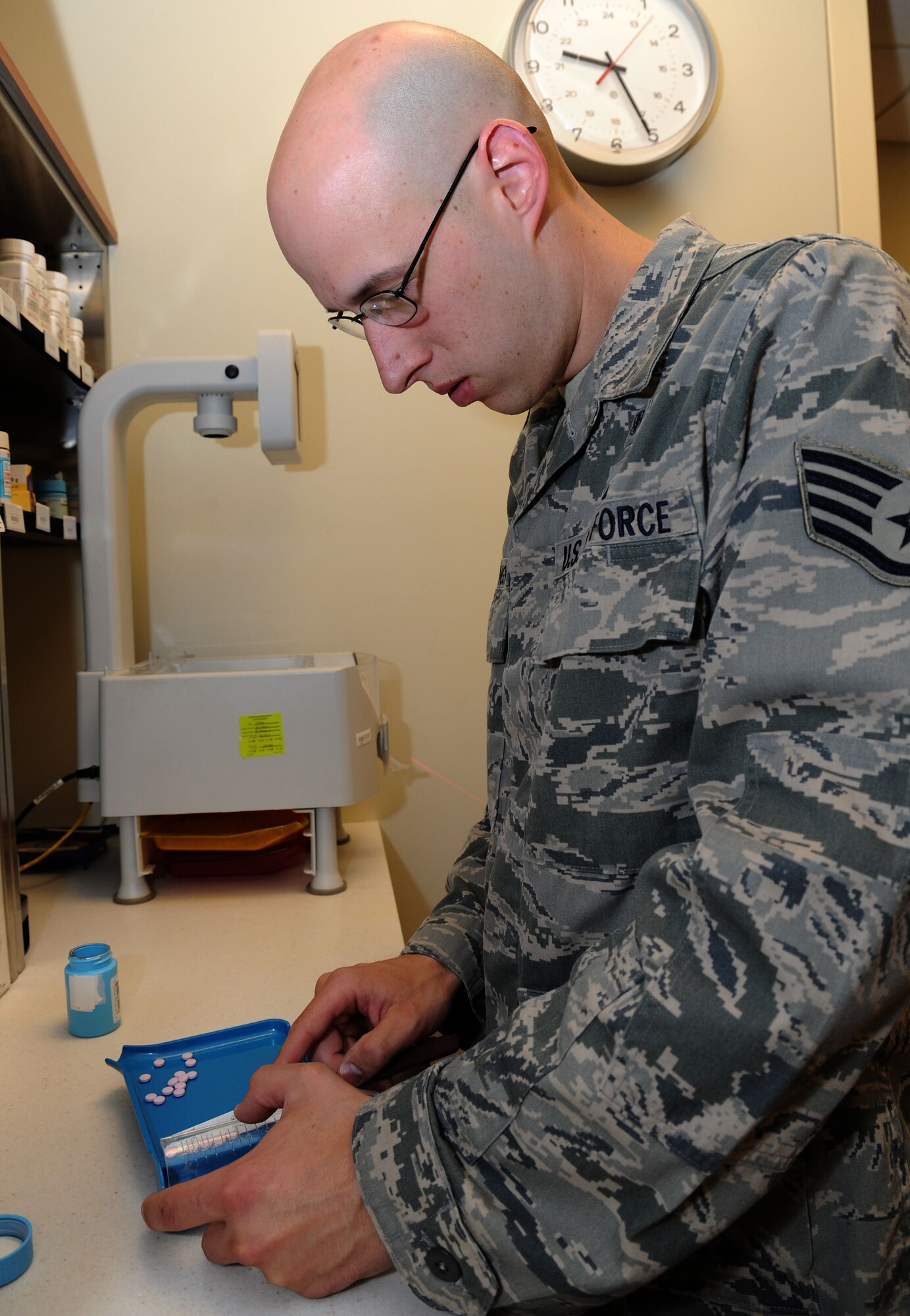Staff Sgt. Matthew Hemmingson, 92nd Medical Support Squadron pharmacy technician, counts medicine tablets in the main pharmacy at Fairchild Air Force Base, Wash., Aug. 13, 2013. Hemmingson has been selected as Fairchild's Finest. (U.S. Air Force photo by Airman 1st Class Janelle Patiño/Released)