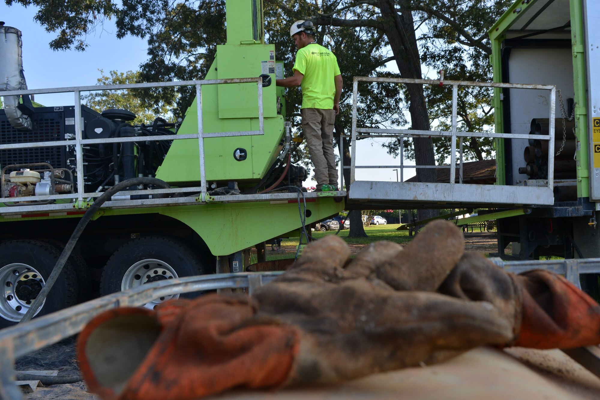 John Sousa, URS Corporation driller, gets prepared to raise the drill for the tunneling process, Shaw Air Force Base, S.C., Aug. 12, 2013.Scheduled well maintenance will take place for the next two weeks on base.  (U.S. Air Force photo by Airman 1st Class Ashley L. Gardner/Released)