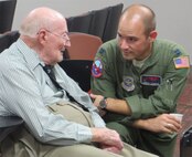 Capt. Robert Damron (right), 911th Air Refueling Squadron pilot, speaks to one of the members of the Order of the Daedalians. The Daedalians is a group of commissioned, warrant and flight officer military pilots. The order's monthly meeting was hosted by the 916th in early August. (USAF courtesy photo)