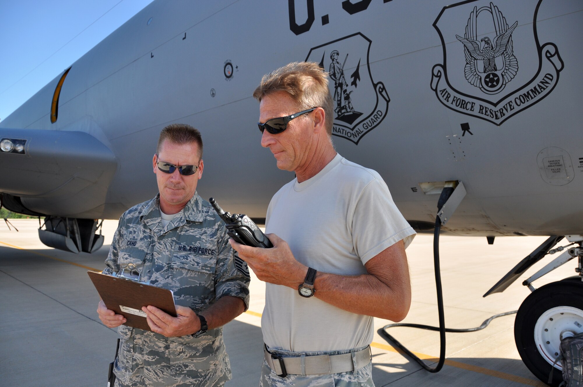507th Aircraft Maintenance Squadron Expeditor Master Sgt. Ronald Huggins, right, discusses flight line operations with Oklahoma Air National Guard 137th Air Refueling Wing’s Senior Master Sgt. William Caho, production superintendent.  Caho is training to fill the pro super position while 507th AMXS pro super, Senior Master Sgt. John Nugent, is TDY.  This marks the first time since the guard/reserve association in 2005 that the pro super duties will be performed by a member of the guard.  Members from the 507th and 137th ARW work seamlessly to ensure each sortie is launched and recovered safely and on time.  (U.S. Air Force photo/Senior Airman Mark Hybers)