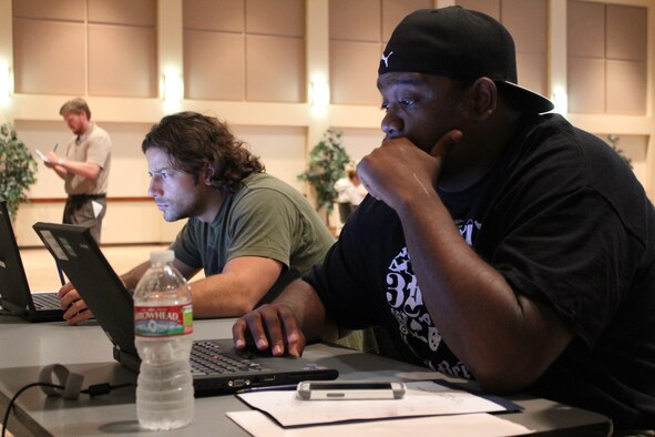 Reservists update their civilian employer data at an Air Force Individual Ready Reserve muster screening at the Leadership Development Center Aug. 8, 2013, on Buckley Air Force Base, Colo. The IRR muster included updating personal readiness information, receiving a basic medical screening and briefings from ARPC, the Department of Veterans Affairs, and active duty, Guard and Reserve recruiters. (U.S. Air Force photo/Maj. Lennea Montandon)