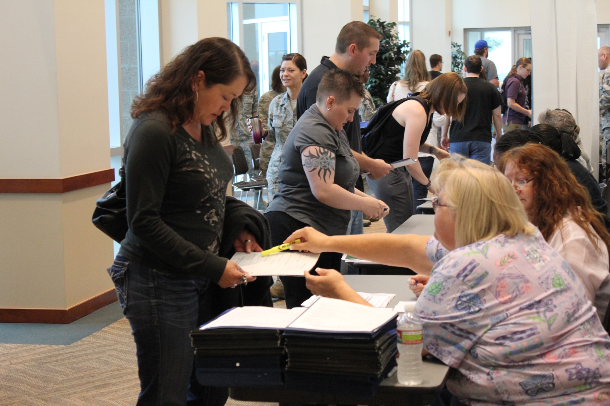 Air Reserve Personnel Center employees check-in and process Airmen who attended an Air Force Individual Ready Reserve muster screening at the Leadership Development Center Aug. 8, 2013, on Buckley Air Force Base, Colo. The muster screening program enhances readiness, boosts combat capability and streamlines reporting procedures in the event of a call-up of these trained, prior service personnel. (U.S. Air Force photo/Maj. Lennea Montandon)