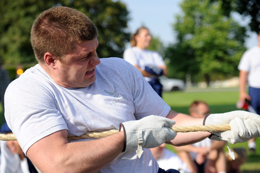 Airman 1st Class Michael Jordan, 93rd Air Refueling Squadron boom operator, participates in the tug of war event during the Commander’s Challenge at Fairchild Air Force Base, Wash., Aug. 9, 2013. The Commander’s Challenge is comprised of four events to include a 1.6 mile run, the fire truck pull, tug of war and an obstacle course. (U.S. Air Force photo by Airman 1st Class Ryan Zeski/Released)