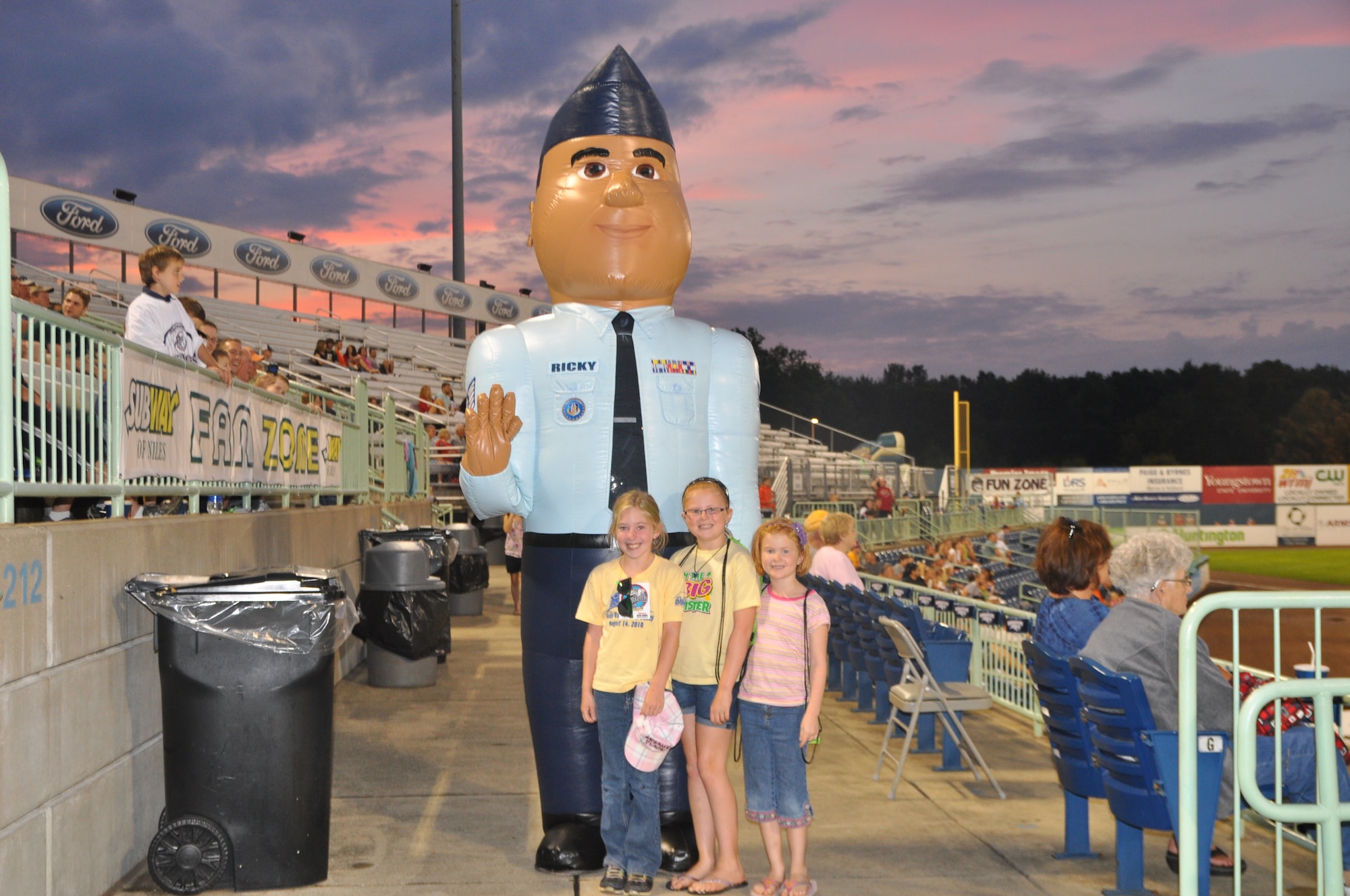 U.S. Air Force Reserve 910th Airlift Wing mascot, Airman Ricky, stands with a group of young fans during a minor league baseball game between the Cleveland Indians Class A affiliate Mahoning Valley Scrappers and the Lowell Spinners at Eastwood Field here, August 7, 2013. Nearly 200 Citizen Airmen along with their families, friends and co-workers were in attendance and representatives from the 910th, based at nearby YARS, were involved in many game night activities. Special to 910th Airlift Wing Public Affairs/Photo by Nick Geraci