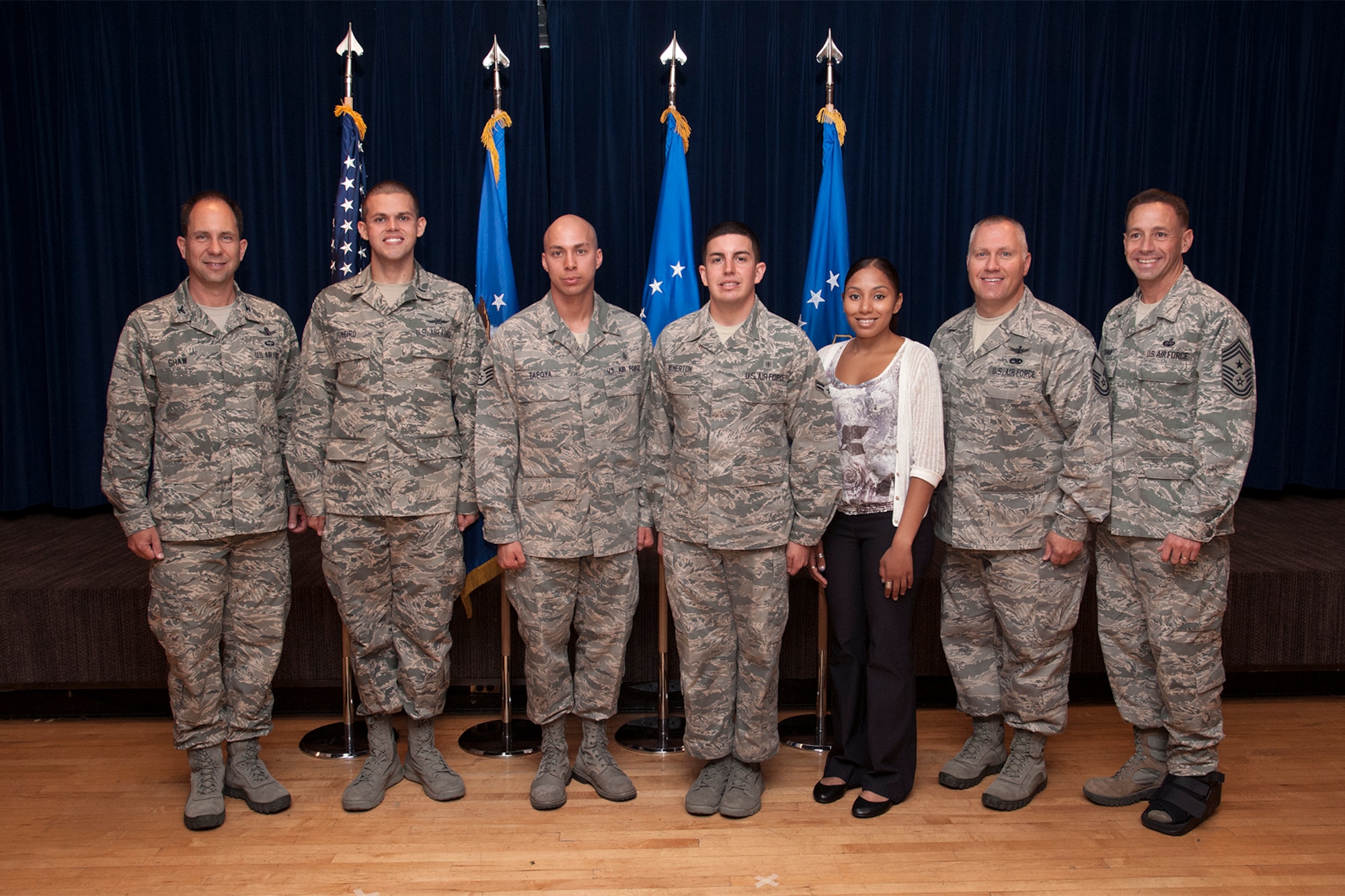 PETERSON AIR FORCE BASE, Colo. – The 21st Space Wing held its quarterly awards breakfast July 30 at The Club. Col. John Shaw (left), 21st SW commander, and Chief Master Sgt. Rich Redman (right), 21st SW command chief master sergeant, presented the awards. Winners for the second quarter include (left to right) 1st Lt. Luis Pineiro, 21st Mission Support Group, CGO of the quarter; Staff Sgt. Angelo Tafoya, 21st Medical Group, NCO of the quarter; Airman 1st Class Nicholas Atherton, 21st MDG, Airman of the quarter; Kiesha Mills, 21st MDG, Civilian of the quarter category I; and Master Sgt. David Carr, 21st Operations Group, Senior NCO of the quarter. Winners not pictured include Daeton Mendiola, 21st Operations Group, Civilian of the quarter category II; and Dr. L J Van Belkum, 21 Space Wing, Civilian of the quarter category III. (U.S. Air Force photo/Craig Denton)