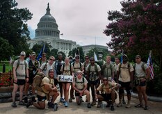 A group of Airmen pose for a group photo after reaching the capitol building in Washington, D.C., Aug 8, 2013. The “DG” 140 is a 140-mile memorial ruck march from the Casualty Reception Center at Dover Air Force Base, Del., to Maj. David Gray’s headstone at Arlington National Cemetery, Aug 4-8, 2013. Many of the Airmen who marched are assigned to the 13th Air Support Operations Squadron, Fort Carson, Colo., and worked for Gray. (U.S. Air Force photo/Senior Airman Carlin Leslie)
