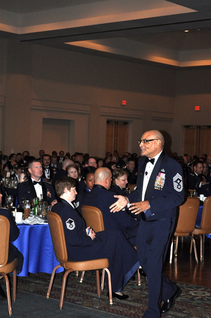 Chief Master Sgt. (retired) Rodney Ellison, former command chief of Air Education and Training Command, addresses the attendees of the Senior Noncommissioned Officer Induction Banquet at Joint Base San Antonio- Lackland, Aug. 9. Ellison was the guest speaker and spoke to future SNCOs about Air Force traditions, mentoring and the importance of family. "People don't care how much you know until they know how much you care," was the advice Ellison gave on mentoring during his speech. (U.S. Air Force photo by Senior Airman Lynsie Nichols)