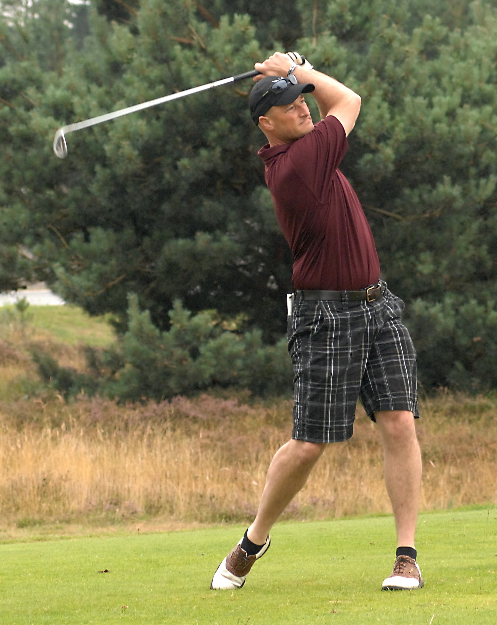 U.S. Air Force Col. Christopher Ireland, 352nd Special Operations Group commander, tees off on the 120-yard short par-3 sixth hole during the 2013 Focus on Mentorship Golf Tournament Aug. 9, 2013, at the Breckland Pines Golf Club on RAF Lakenheath, England. The sixth hole had a closest-to-the-pin competition, which was won by Ken Thompson, British-American Committee chairman. Some holes had signs with motivational quotes such as, “The best way to succeed in life is to act on the advice we give to others.” (U.S. Air Force photo by Gary Rogers/Released)