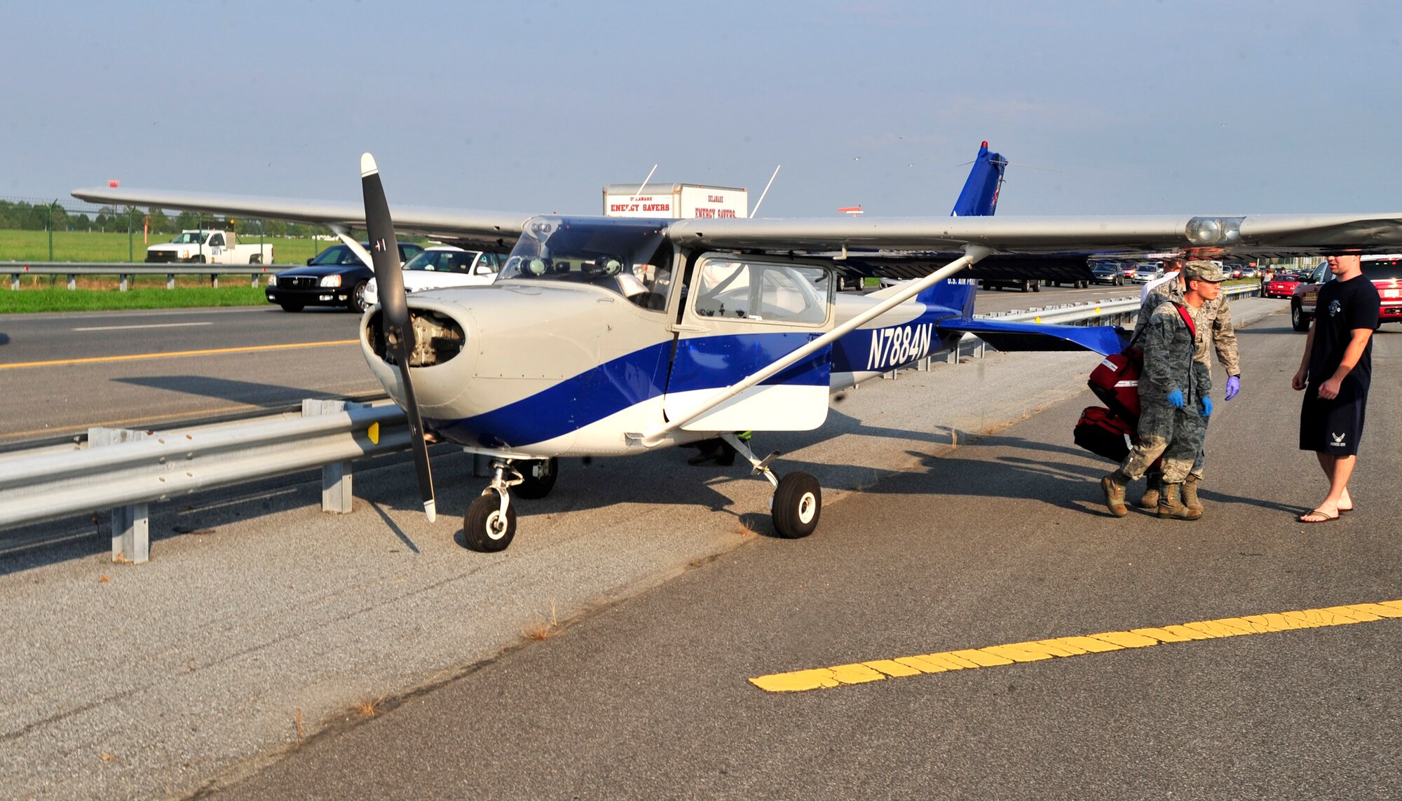 A Dover Air Force Base Aero Club Cessna aircraft sits on the southbound lane of Route 1 after making an emergency landing Aug. 12, 2013, in Dover, Del. There were no injuries and the cause of the incident is under investigation. (U.S. Air Force photo/Tech. Sgt. Chuck Walker)