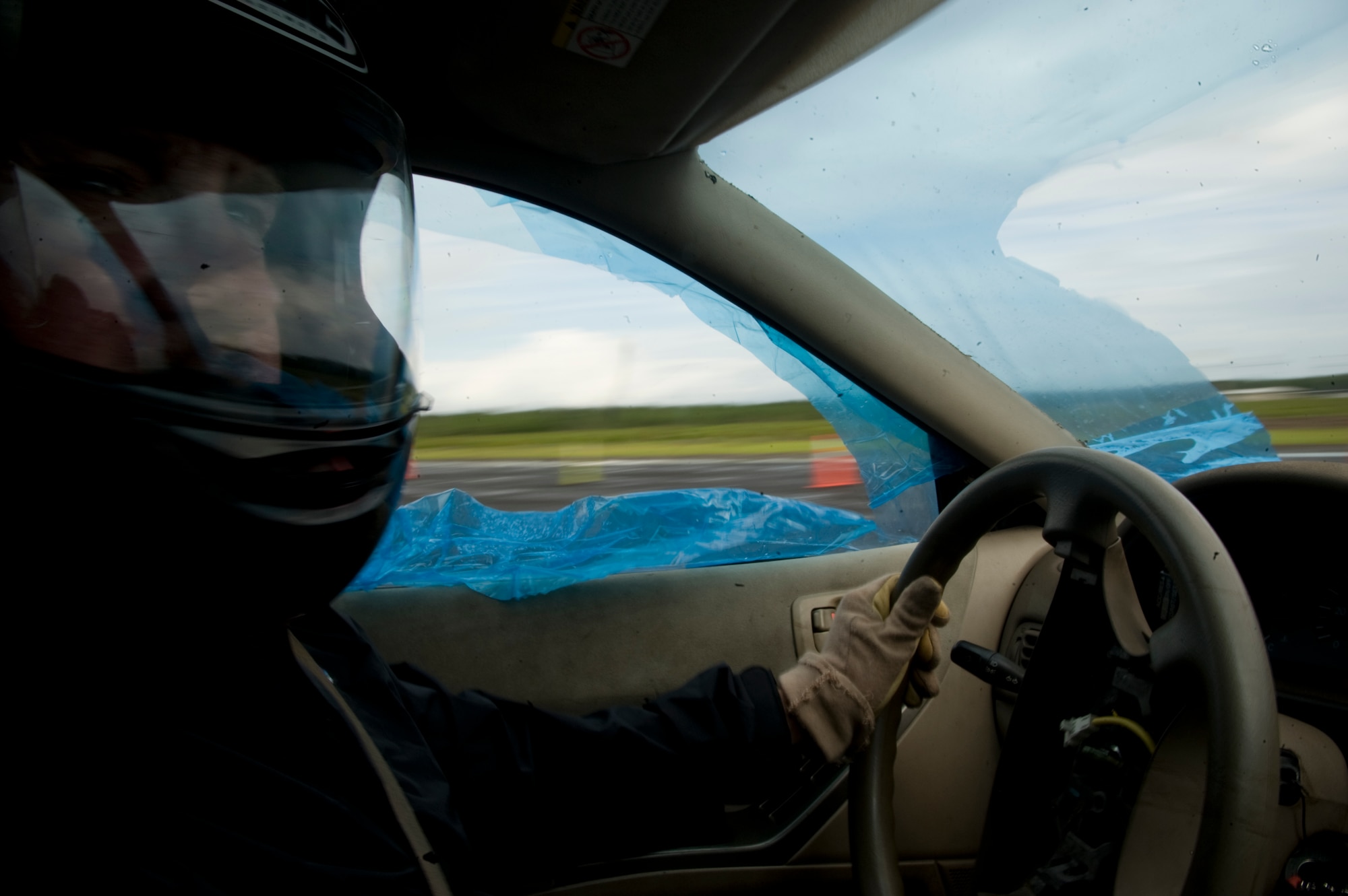 An instructor performs a 180-degree turn to allow another student to chase him and perform a Precision Immobilization Technique, better known as the PIT maneuver, during the Combat Aviation Advisor Military Qualification Skills Course defensive driving module on Eglin Range, Fla., June 19, 2013.  The instructors performed quick turns to sharpen their handling skills while the driving exercises reset for students in queue.  (U.S. Air Force photo by Airman 1st Class Benjamin Kim)