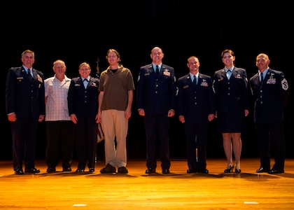 Col. Al Miller, 437th Airlift Wing vice commander (left), and Chief Master Sgt. Shawn Hughes, 437th AW command chief (right), congratulate the 437th Airlift Wing 2nd Quarter Award Winners after a ceremony Aug. 8, 2013, at Joint Base Charleston – Air Base, S.C. (Left to right) Larry Smith, 437th Operations Support Squadron airfield manager, 1st Lt. Andrea Gehrman, 437th Maintenance Group assistant aircraft maintenance unit officer in charge, Gregg Passmore, 437th Aerial Port Squadron material handler, Tech. Sgt. Joshua Denny, 16th Airlift Squadron Soll II evaluator loadmaster, Master Sgt. Seth Malcolm, 16th Airlift Squadron loadmaster and Senior Airman Anna Sozzi, 437th OSS intelligence analyst. The winners were nominated for creating a process which includes better coverage of maintenance support activities, improve quality of life, evenly distribute the workload for all shifts and create more reliable work schedules for maintenance workers. (U.S. Air Force photo/Tech. Sgt. Rasheen Douglas)