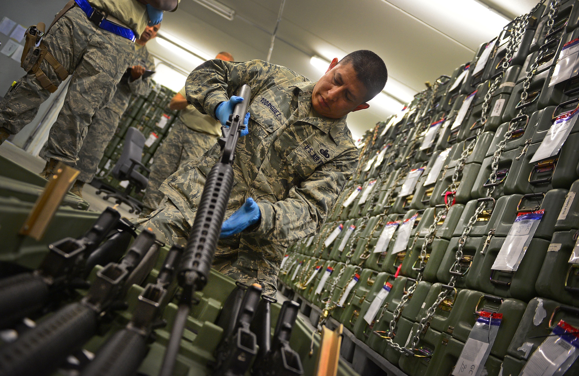 Master Sgt. Luis Rodriguez, 31st Logistics Readiness Squadron quality assurance evaluator, inspects a weapon, Aug. 8, 2013, at Aviano Air Base, Italy. Quality assurance evaluators are responsible for accurately inspecting the work of all LRS flights and reporting any discrepancies that should be resolved. (U.S. Air Force photo/Airman 1st Class Matthew Lotz)
