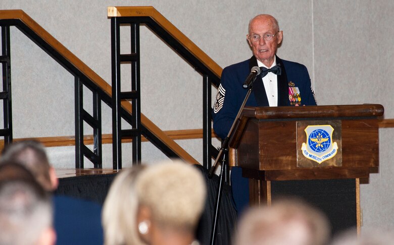 Chief Master Sgt. of the Air Force James McCoy, who retired in 1981, speaks to the attendees of the Annual Senior Non-commissioned Officer Induction Ceremony Aug. 9, 2013, at McConnell Air Force Base, Kan. McCoy was the honored guest speaker at the function and offered advice from his decades of experience to the new senior NCOs. (U.S. Air Force photo/Airman 1st Class Victor J. Caputo)