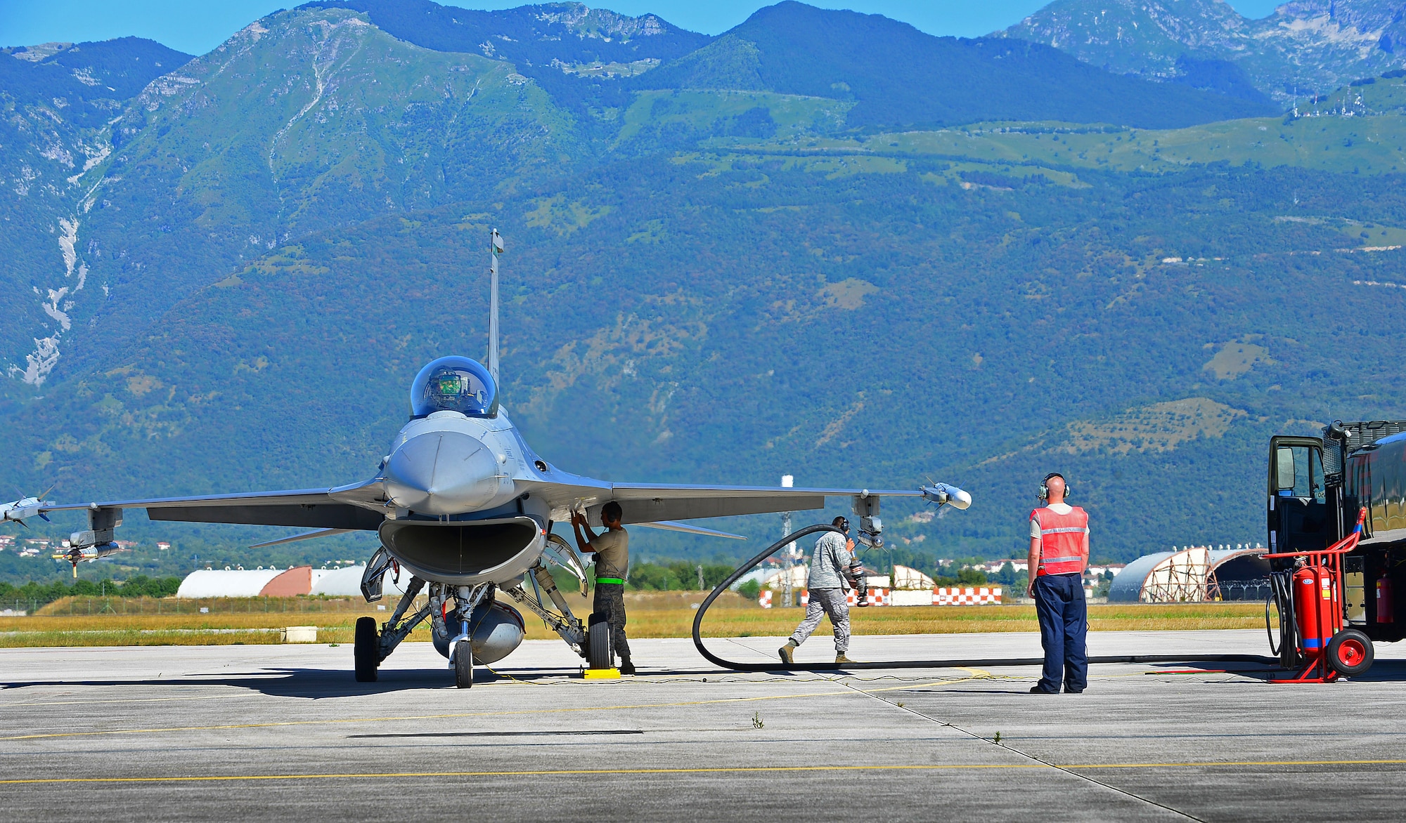 An Airman from the 31st Logistics Readiness Squadron fuels management flight refuels an F-16 Fighting Falcon, July 31, 2013, at Aviano Air Base, Italy. With two fighter squadrons training regularly, the fuels management flight pumps more than 500,000 gallons of fuel into an aircraft each month. (U.S. Air Force photo/Airman 1st Class Matthew Lotz)