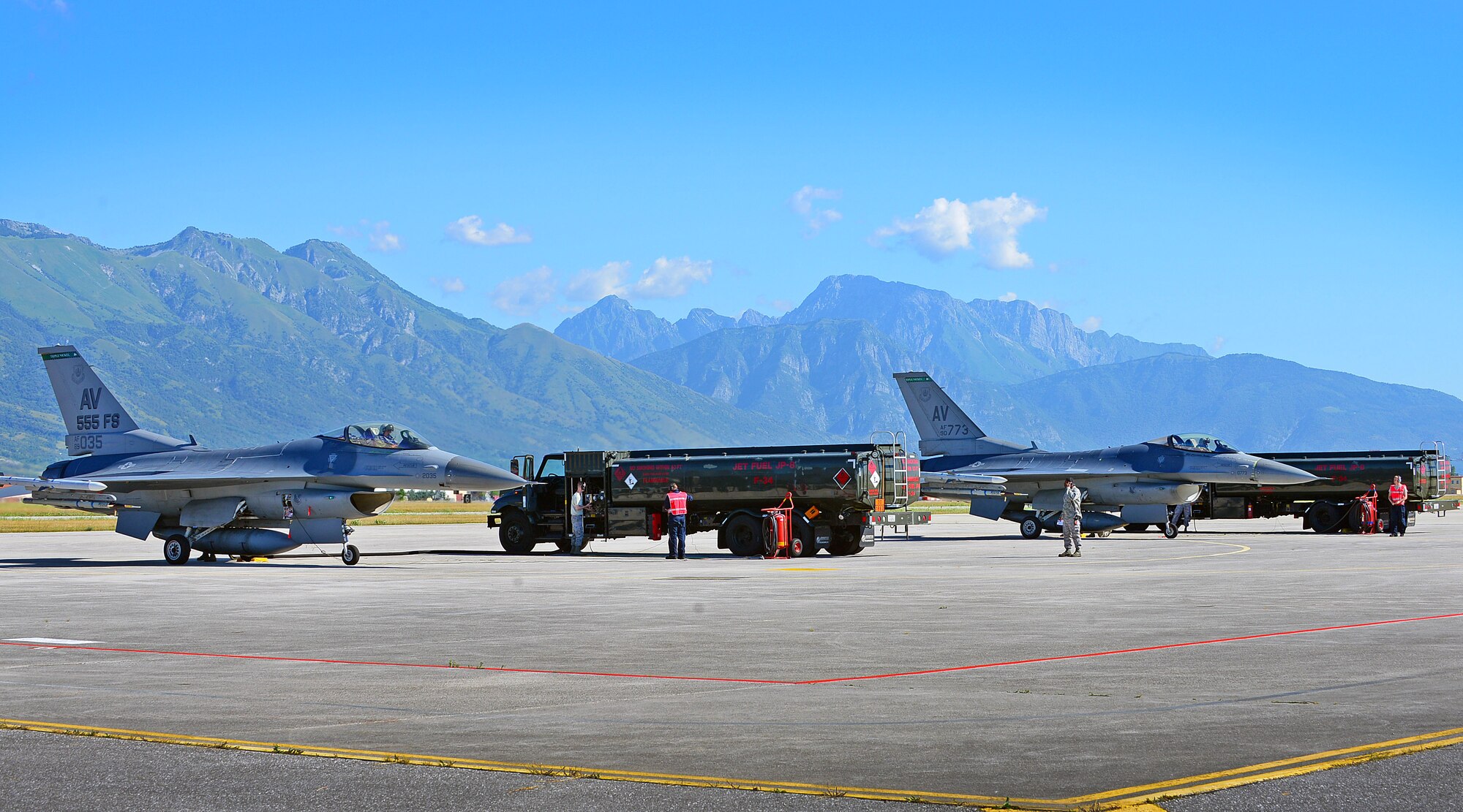 Airmen from the 31st Logistics Readiness Squadron fuels management flight refuel F-16 Fighting Falcons, July 31, 2013, at Aviano Air Base, Italy. The fuels management flight assists with the refueling of jets and all government vehicles on base. (U.S. Air Force photo/Airman 1st Class Matthew Lotz)