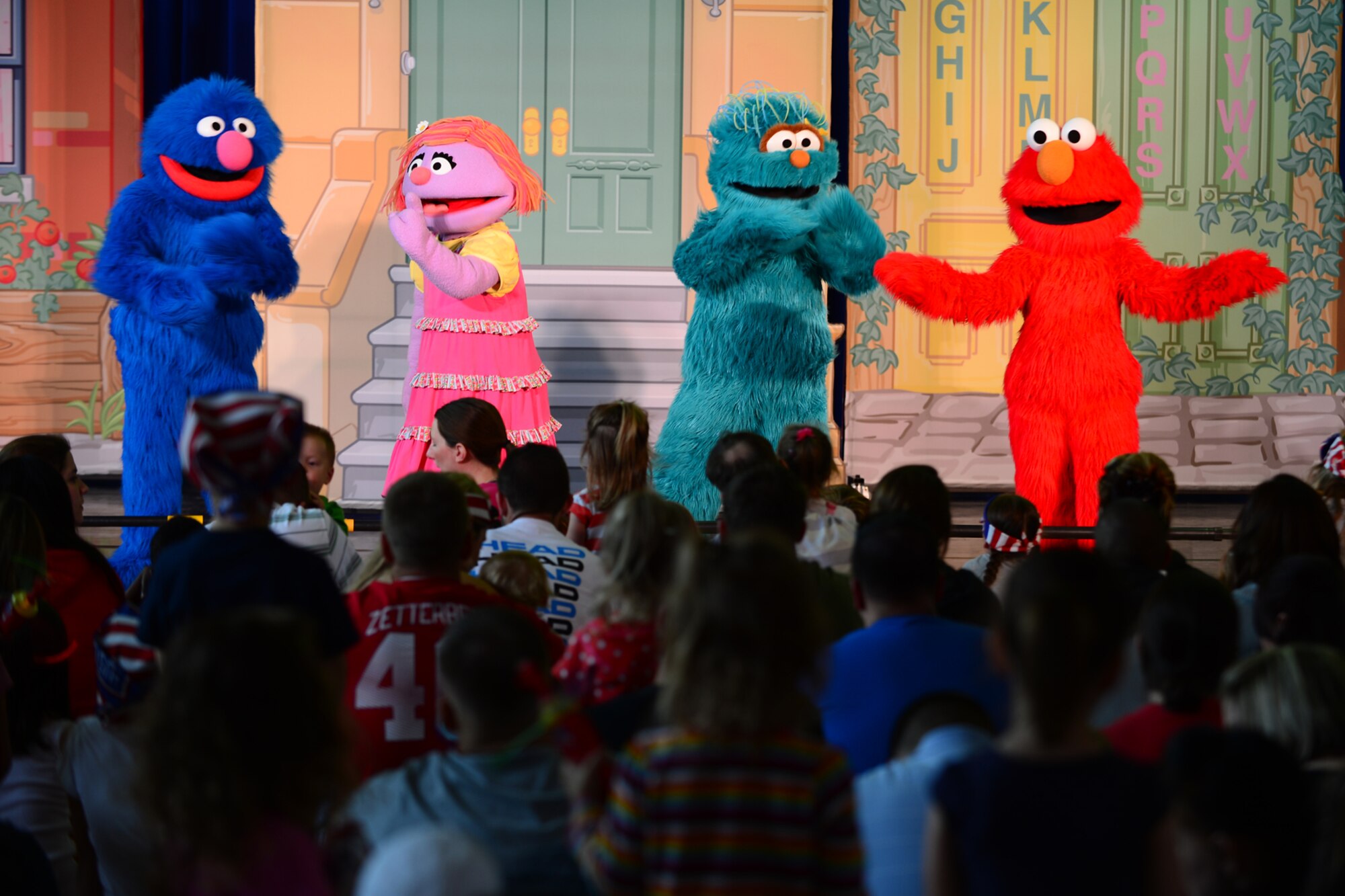 Elmo and friends perform on stage during the Sesame Street/USO Experience at Royal Air Force Lakenheath, England, Aug. 10, 2013. The Sesame Street/USO Experience for Military Families is the USO’s longest-running, free-traveling tour based on Sesame Street's military family initiative. The tour is traveling to 42 installations in eight countries in the European and Pacific regions. (U.S. Air Force photo by Airman 1st Class Dana J. Butler/Released)