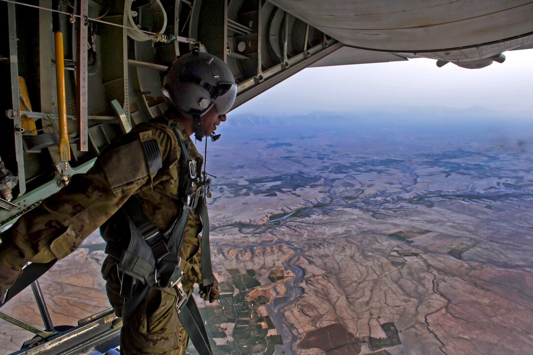 U.S. Air Force Airman 1st Class Michael R. Brown II checks the seal around a C-130 Hercules aircraft ramp after releasing cargo during an airdrop mission over Afghanistan, Aug. 2, 2013. Brown, an aircraft loadmaster, is assigned to the 774th Expeditionary Airlift Squadron.