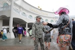 Soldiers of the 198th Military Police Battalion search spectators at Churchill Downs on May 4, 2013. Guardsmen were issued metal-detecting wands as an upgrade to security at the Kentucky Derby.