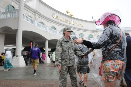 Soldiers of the 198th Military Police Battalion search spectators at Churchill Downs on May 4, 2013. Guardsmen were issued metal-detecting wands as an upgrade to security at the Kentucky Derby.