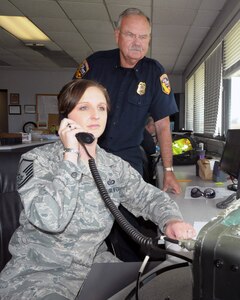 Master Sgt. Amy Zuniga of the 146th Airlift Wing and CAL FIRE officer Dan Sendek coordinate movement and reloading of CAL FIRE aircraft at the air tanker base staging out of Channel Islands Air National Guard Base in Port Hueneme, Calif.