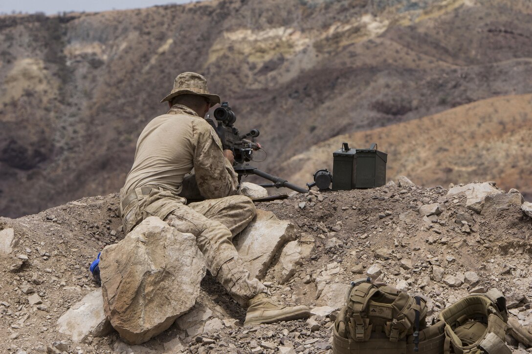 U.S. Marine Corps Lance Cpl. Jake Lee, a rifleman from Fayetteville, Ga., assigned to Company K, Battalion Landing Team 3/2, 26th Marine Expeditionary Unit (MEU), mans an M240 medium machine gun during a mock defense of a forward operating base during sustainment training in the U.S. 6th Fleet area of responsibility, Aug. 4, 2013. The 26th MEU is a Marine Air-Ground Task Force forward-deployed to the U.S. 6th Fleet area of responsibility aboard the Kearsarge Amphibious Ready Group serving as a sea-based, expeditionary crisis response force capable of conducting amphibious operations across the full range of military operations. (U.S. Marine Corps photo by Cpl. Michael S. Lockett/Released)